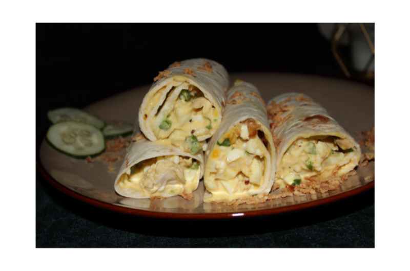 Whole-grain wrap with Scrambled Eggs, Hummus, and Cucumber