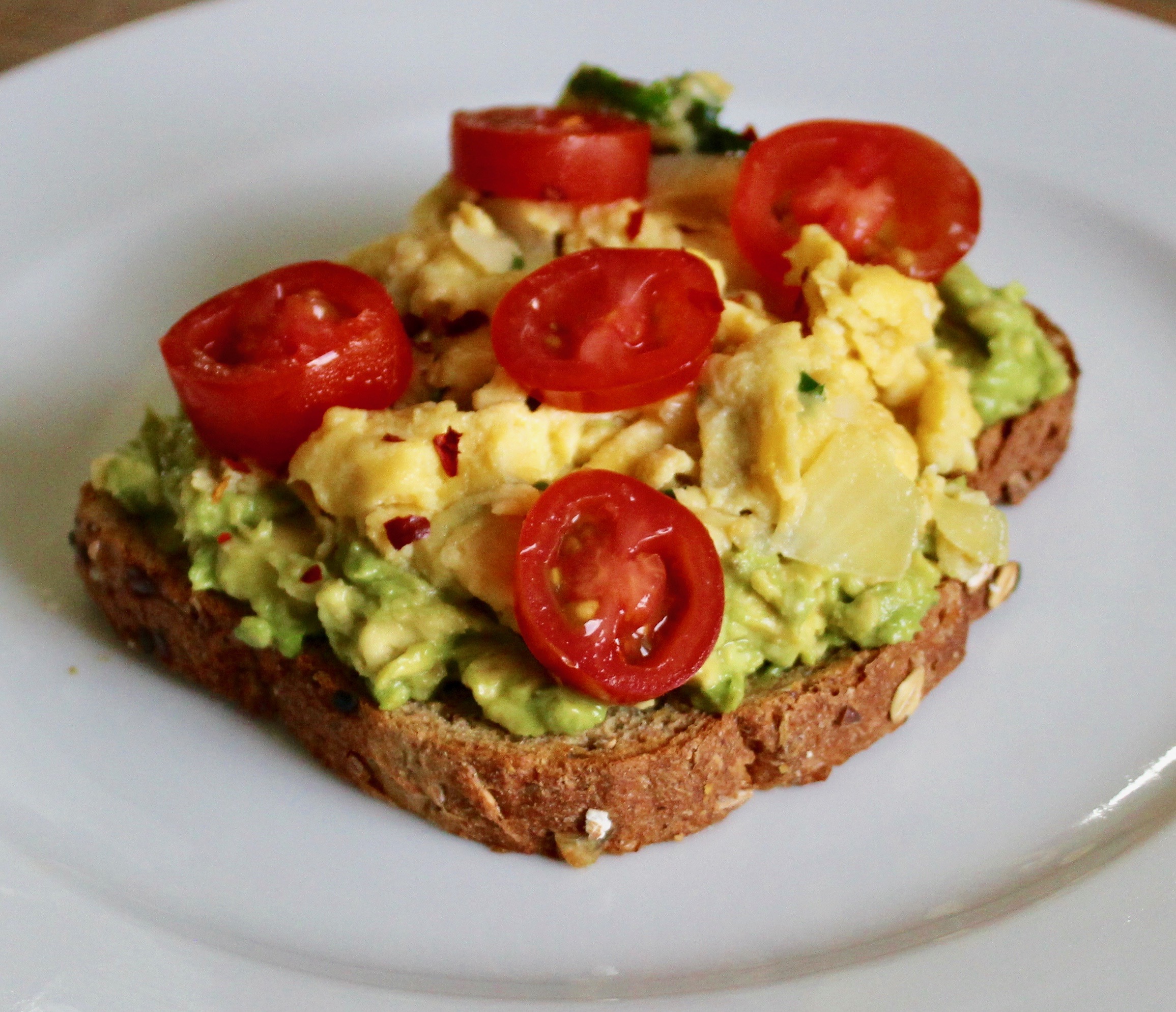 Avocado Toast with Scrambled Eggs and Cherry Tomatoes | Whole Living Eat Well